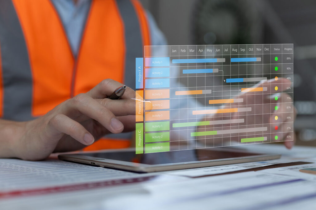 construction worker using digital tablet to monitor project timeline